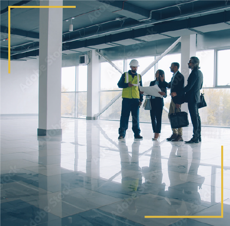 Picture of business people talking with a construction building inside a building